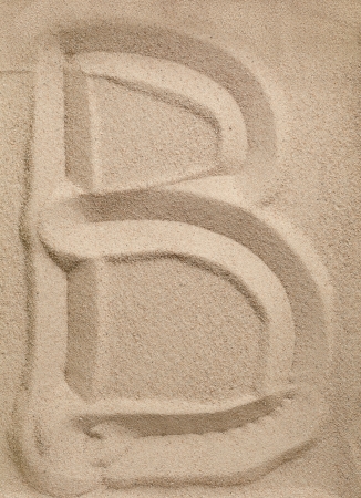 Letter B of the alphabet writing on the sandの写真素材