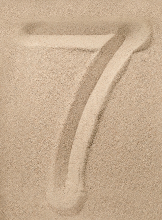 Number seven writing on the sandの写真素材