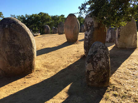 Neolithic standing stones cast long shadows in southern Portugalの写真素材