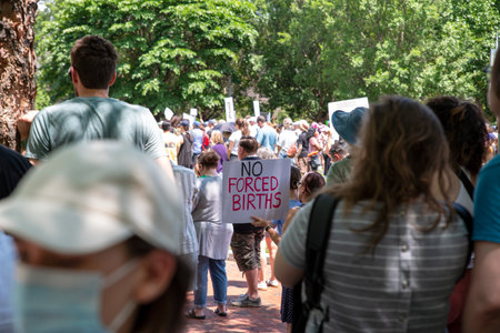 Woman in crowd at pro-choice Josh Shapiro rally holds a sign NO FORCED BIRTHSのeditorial素材
