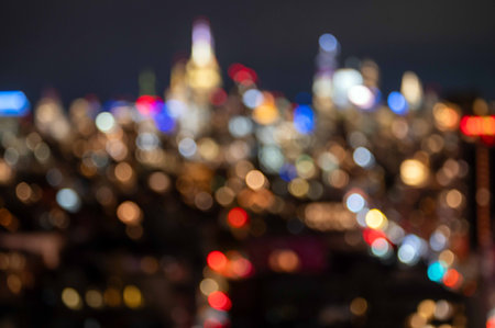 Excellent abstract defocused bokeh background dark night image of New York City skyline bright...
