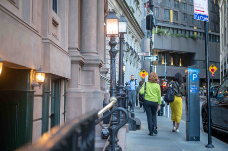 New York, NY, USA 10-05-2023 pedestrians on a Manhattan street with antique lights beautiful...