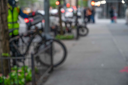 Defocused urban street scene background with bicycles copy space