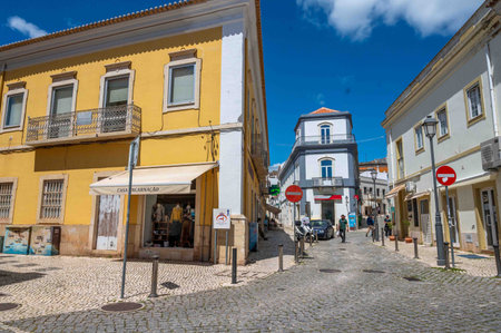Winding cobblestone street and ancient town square Silves Portugal travelのeditorial素材