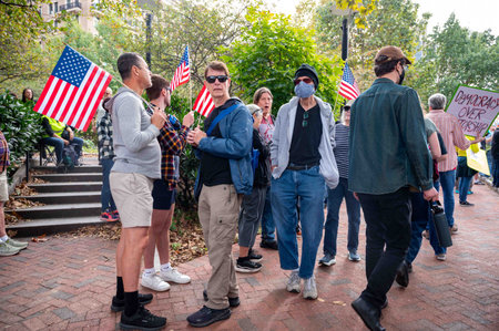 Protesters at No Kings political protest rally Philadelphia people signs flagsのeditorial素材