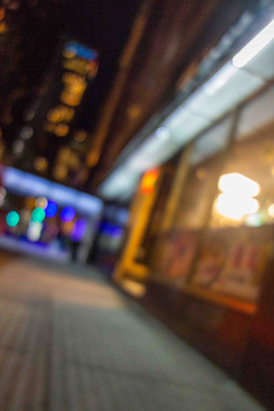 Blurred and crooked nightime city street intoxication drunk DUI concept