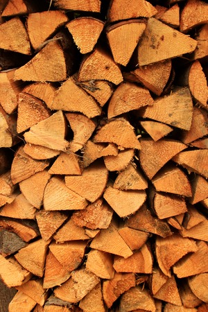Chopped firewood tree logs for winter fire.