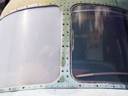 Porthole of an old military helicopter. Texture background rust iron.の写真素材