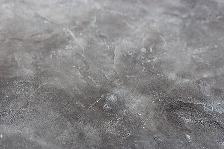 Texture of a grey stone background. Dark Cement and concrete texture, selective focus.の写真素材