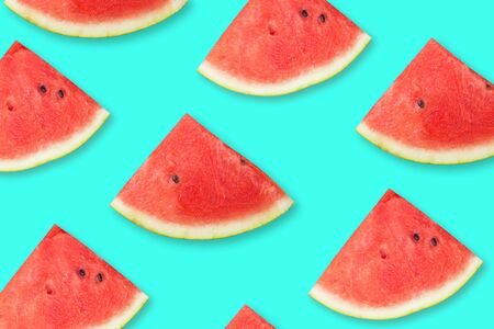 Watermelon slises on bright blue background. Summer concept. Top view. Flat lay. Fruit pattern