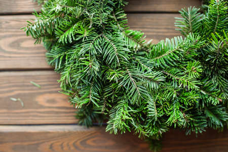 Tree branch on rustic wooden background. christmas decorationの写真素材