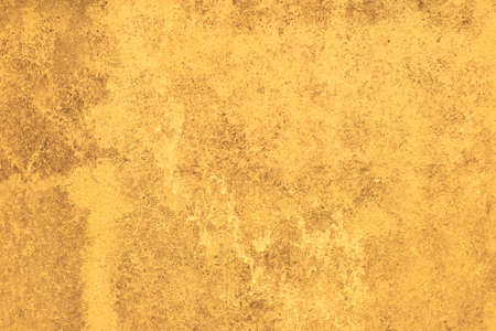 Beautiful abstract grungy yellow wall background. Perfect texture with space.
