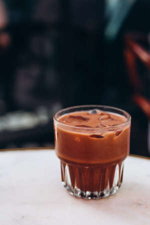 Chocolate cocktail with ice. Cooling drinks, desserts in the summer heat. Order in cafe