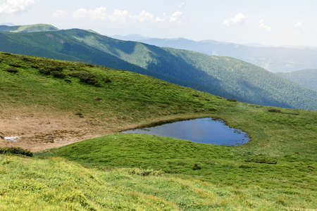 Heart shaped lake, Carpathian mountains, Ukraine, Europe. Discover the beauty of earth. Tourism and nature conceptの写真素材