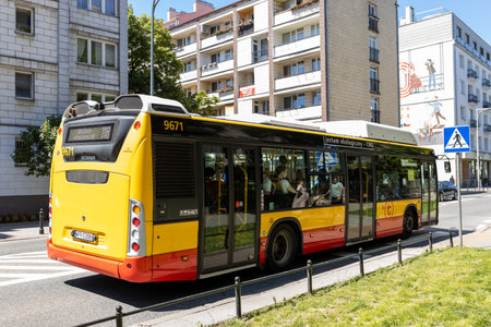 11.06.2022 Poland, Warsaw - The passenger electric bus goes down the street, number 118. Transportation conceptのeditorial素材