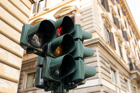 Traffic light and city concept in vintage style. A traffic light shows red lightの写真素材