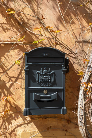 Black Letter box vintage design hanging on wall in Romeの写真素材