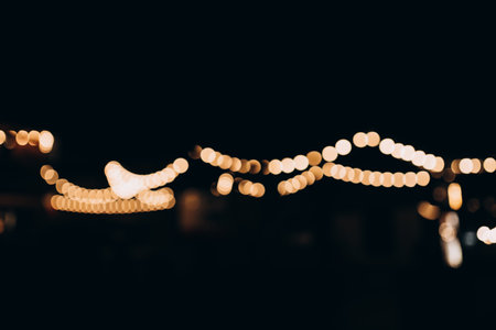 Decorative string lights at night time, Defocused Background, night city life backdrop, party time...
