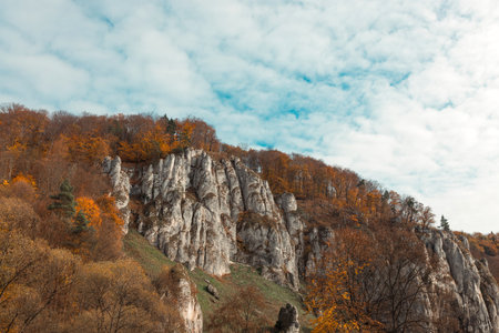 The mountain autumn landscape with colorful forest. Ojcow village in autumn in Poland