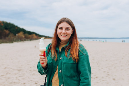 Happy 30s Women eating traditional italian ice cream gelato. Food concept