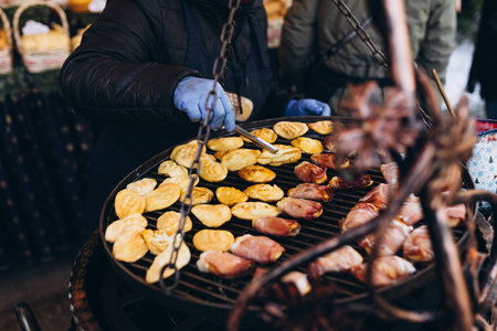 Fresh grilled smoked sheep cheese. Traditional polish local food. Traditional small Polish oscypek - fried sheep cheese, at street stall in Cracow, Poland. Festival of street foodの写真素材