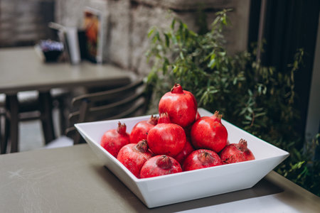Ripe pomegranate fruits on the desk. Food conceptの写真素材