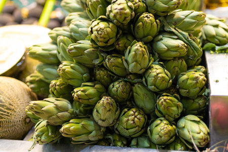 Fresh artichokes in a market. Fruit and vegetable stand, view of artichokesの写真素材