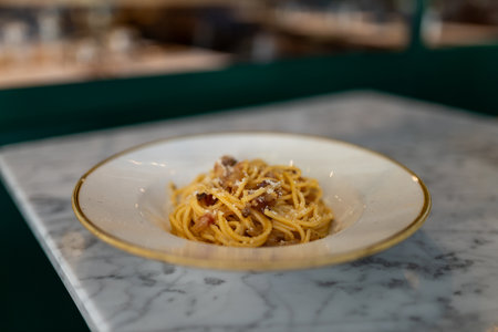 Close up carbonara pasta. Spaghetti with pancetta, egg, parmesan cheese and cream sauce. Traditional Italian cuisine.の写真素材