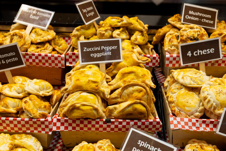An empanada is a type of pastry baked or fried in Hispanic cultures. Mix set empanadas on outdoors...