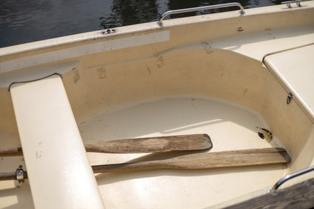 Closeup of the two oars mount on a rowboat. Rowboat prows with oars inside