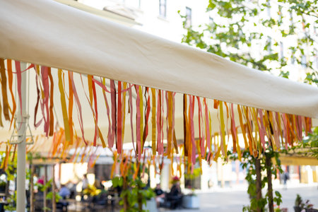 Colorful Festive Ribbons Hanging Outdoors. Joy, happiness and celebration.の写真素材