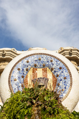 Multicolored mosaic of Salamander or Dragon. Lizard Fountain at Park Guell, popular touristic objects in Barcelona, Spain. Multicolored mosaic of Salamander or Dragon. Concept of tourism and vacationの写真素材