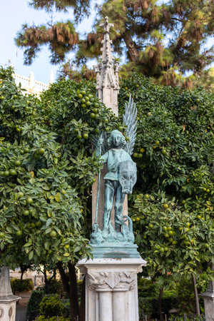 bronze figure of the archangel Saint Michael in the Old Town of Valenciaの写真素材
