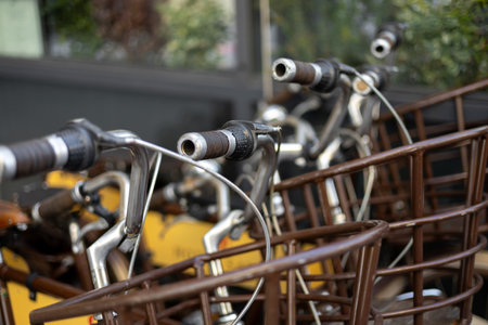 Bicycle parking in the city. Ecological type of transport. Close-up. Renting bicycles for exploring the cityの写真素材