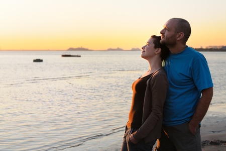 Portrait of bald young woman and bald man at sunset の写真素材