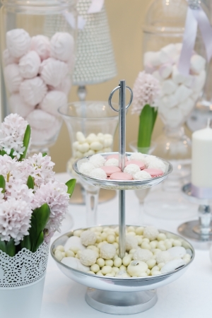 Delicious wedding sweets  yellow and pink table set の写真素材