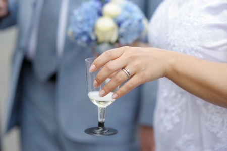 Woman holding glass with champagneの写真素材