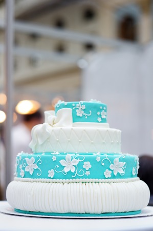 Delicious turquoise wedding cake decorated with sugar flowersの写真素材