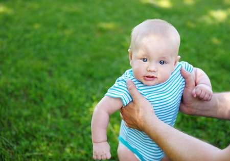 Little baby boy at the sunny parkの写真素材