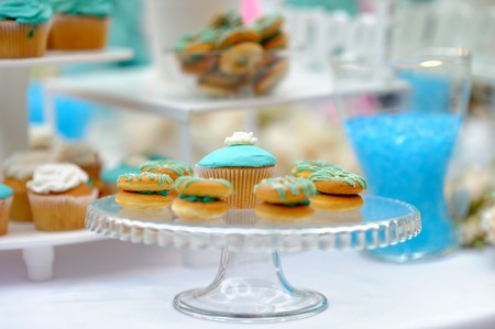 Delicious wedding cupcakes on glass dishの写真素材