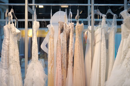 A few beautiful wedding dresses on a hangerの写真素材