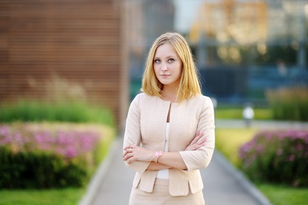 Outdoors portrait of young beautiful business womanの写真素材