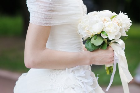 Bride holding wedding flowers bouquetの写真素材