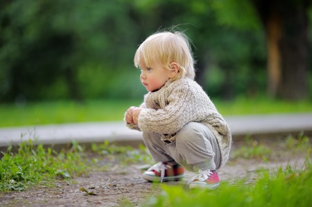 Toddler playing at the spring or summer dayの写真素材