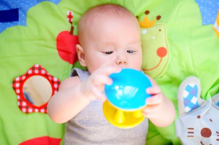 Little baby play with bright toy
