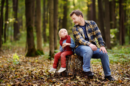 Little boy with his father during stroll in the forest. Active family time on nature. Hike with little kidsの写真素材