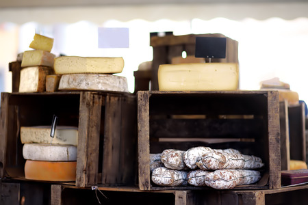 Variety of organic cheeses and home made sausages on farmer market in Strasbourg, France. Typical European local farmer marketの写真素材