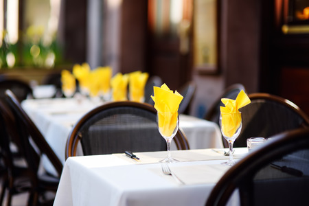 Outdoor cafe on sunny spring day in Strasbourg, Alsace, France. Stylish table decoration with yellow colorの写真素材