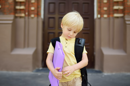 Student near the school building. Back to school.の写真素材
