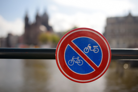 Road sign on the railing of the bridge in Amsterdam, Netherlands prohibiting access for bicycles and motorbikes. Road safety. Tourism and travel by Holland.の写真素材
